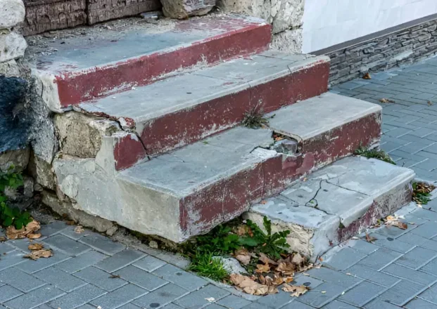 Broken concrete edges on exterior steps